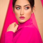 Model in pink warm knit sweatshirt